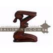 balishine This abstract statue is a handicraft of Bali made from suar wood.