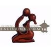 balishine This abstract statue is a handicraft of Bali made from suar wood.