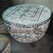 balishine This beautiful coffee table is made in Bali, Indonesia, from natural palm wood. Top is made with natural teak wood. Handmade carving for top and side with primitiv motif.